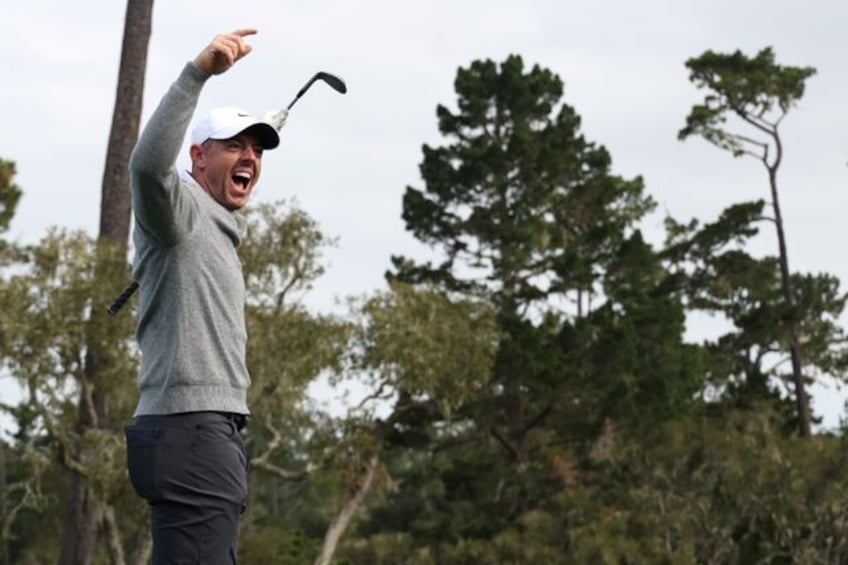 Rory McIlroy celebrates his hole-in-one on the 15th hole at Spyglass Hill during the first