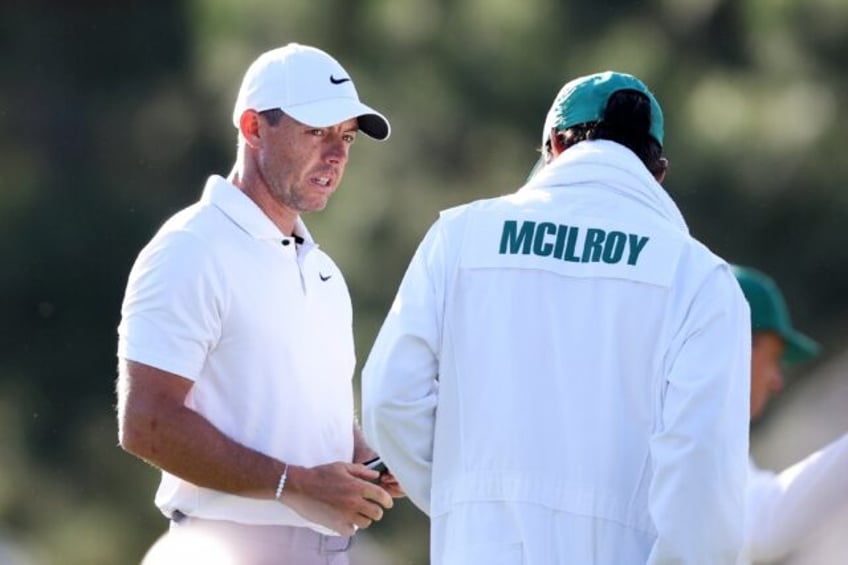 Rory McIlroy of Northern Ireland looks on from the 17th green during the first round of th