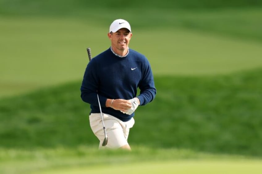 World number two Rory McIlroy of Northern Ireland walks to the 18th green during a practic