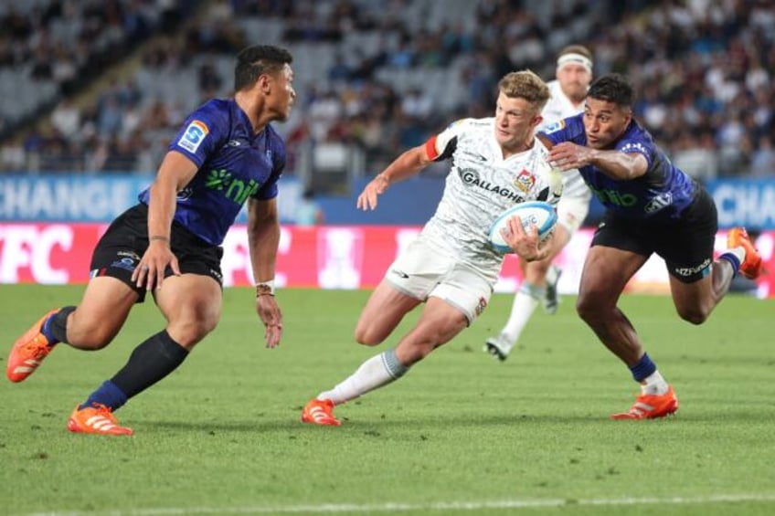 Playmaker Damian McKenzie scored two tries as the Waikato Chiefs beat the Auckland Blues 2