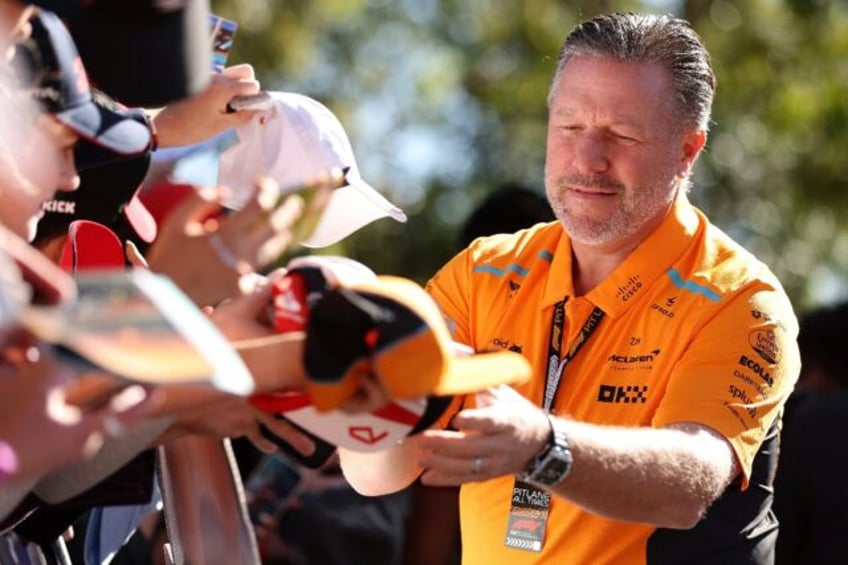 McLaren Racing CEO Zak Brown signs autographs at the Australian Grand Prix