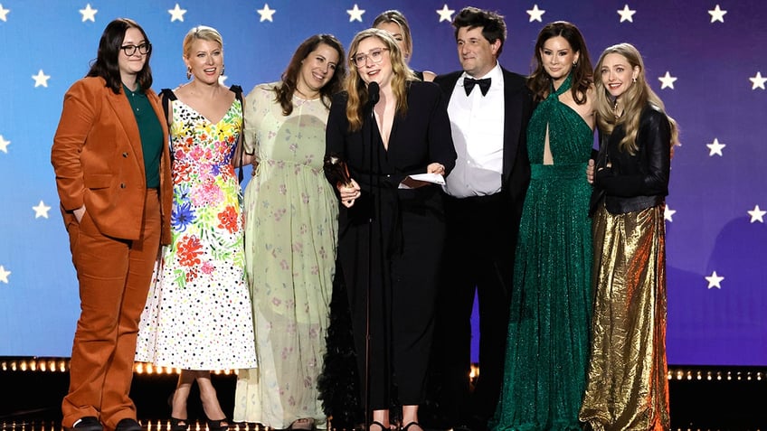 Liz Hannah, Victoria Thompson, Jordana Mollick, Elizabeth Meriwether, Michael Showalter, Rebecca Jarvis and Amanda Seyfried on stage at 2023 Critics Choice Awards