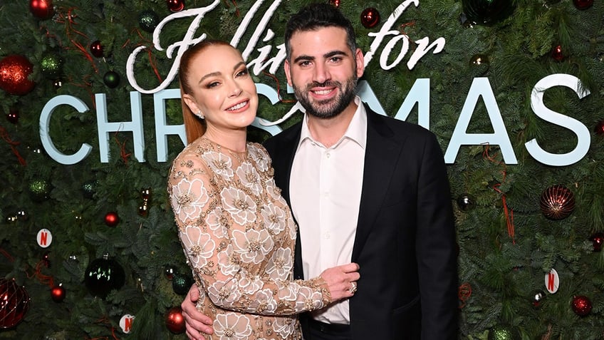 Lindsay Lohan and her husband at the Falling for Christmas premiere