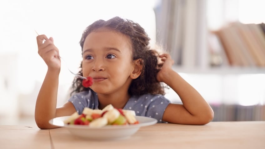 Girl eating healthy foods