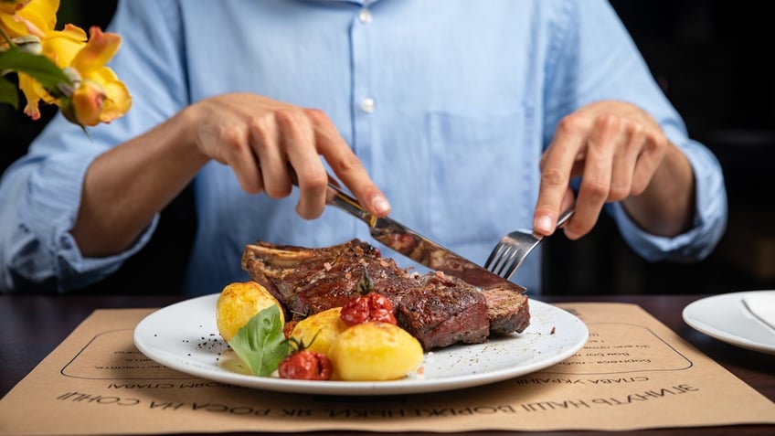 Man eating steak