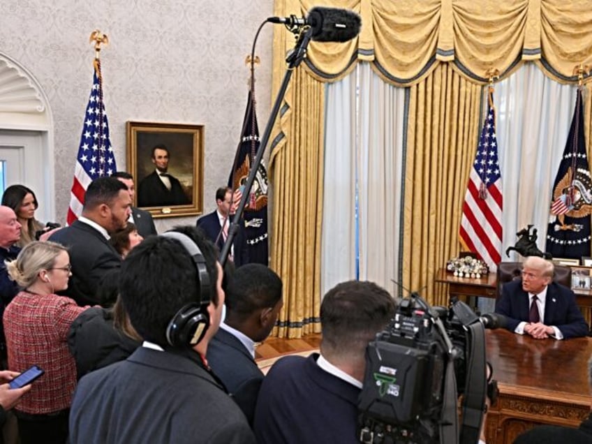 US President Donald Trump speaks to the media as he signs executive orders in the Oval Off