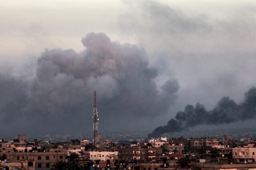 Smoke billows over Khan Yunis in the southern Gaza Strip on Tuesday