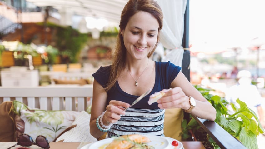 Woman eating seafood