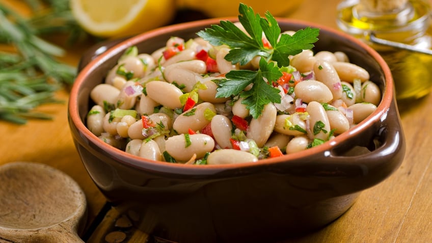 Cannellini white bean salad with olive oil, parsley and lemon.