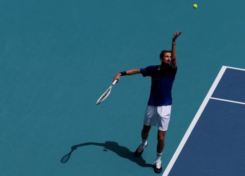 Daniil Medvedev prepares to serve against Germany's Dominik Koepfer during their match at