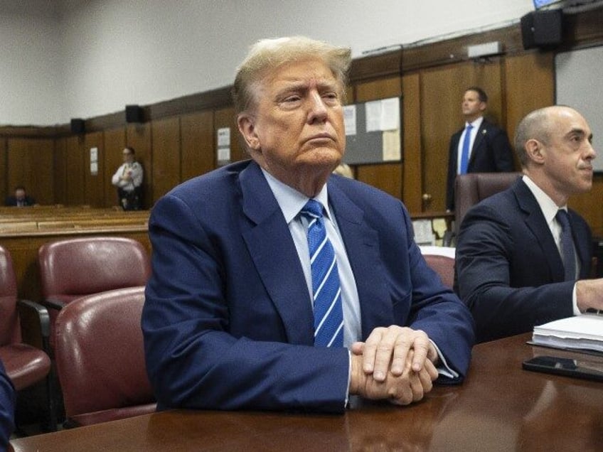 Former U.S. President Donald Trump sits in the courtroom as he awaits the start of the sec