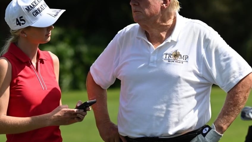 President-elect Trump and Natalie Harp on the golf course.