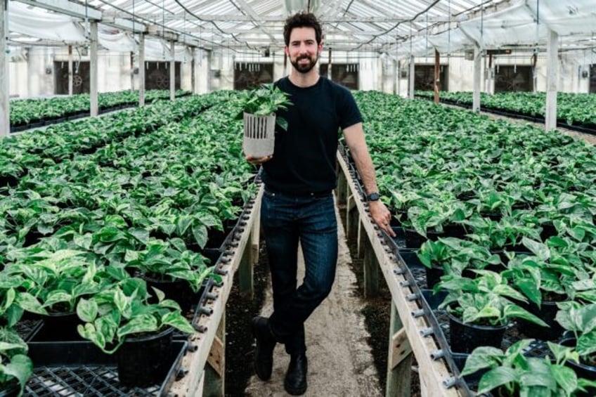 Lionel Mora, co-founder of French startup Neoplants, poses for a portrait inside the green