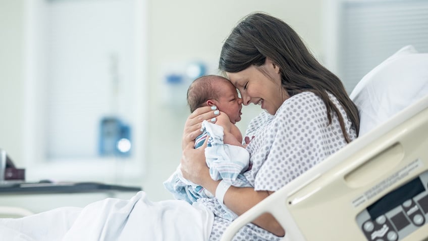 mother holding newborn