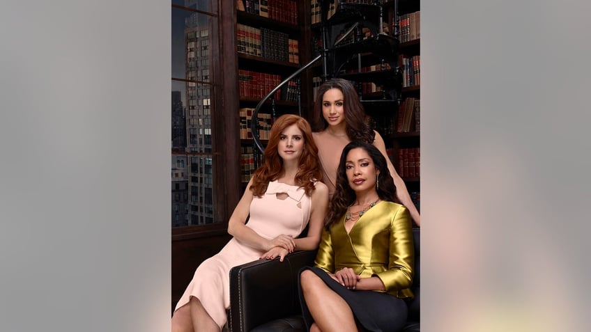 Sarah Rafferty, Meghan Markle and Gina Torres in character during a promo for Suits