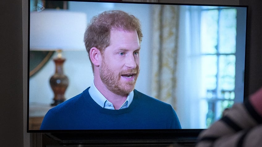 A person at home in Edinburgh watching the Duke of Sussex being interviewed by ITV's Tom Bradby