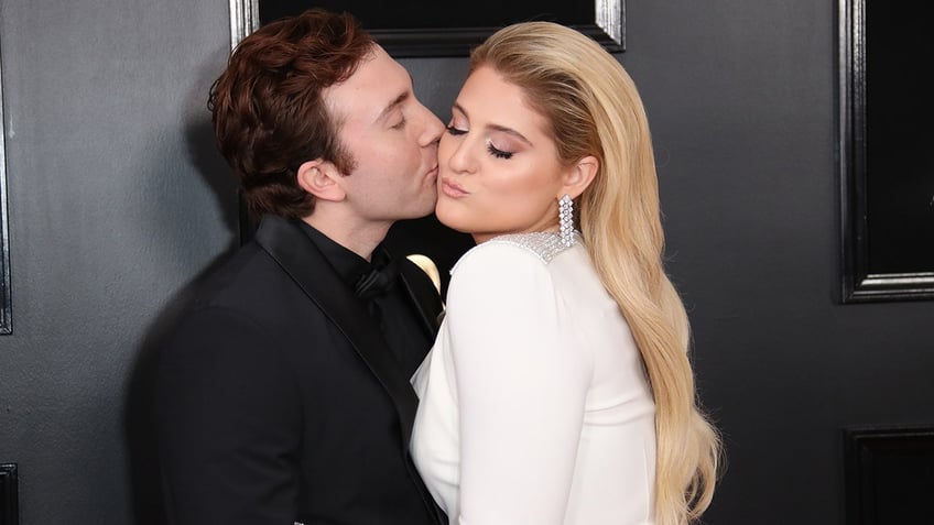 Daryl Sabara kisses Meghan Trainor on the cheek