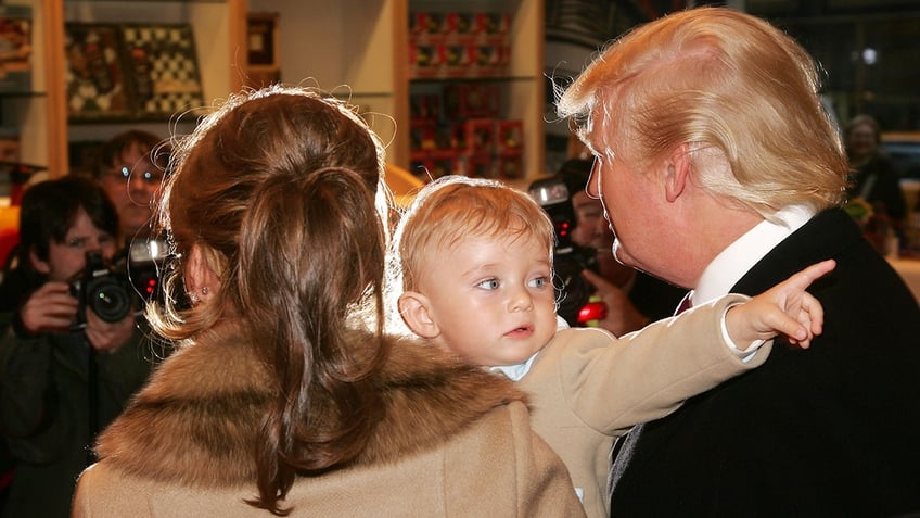 Melania Trump, young Barron Trump and Donald Trump attend the 16th Annual Bunny Hop at FAO Schwartz to benefit the Memorial Sloan-Kettering Cancer Center in 2007.