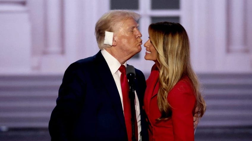 Former US President Donald Trump, left, and former First Lady Melania Trump during the Republican National Convention (RNC) at the Fiserv Forum in Milwaukee, Wisconsin, US, on Thursday, July 18, 2024. Donald Trump, who accepted his party's presidential nomination, delivered his first public address since surviving a failed assassination attempt, relating an incident in detail that he called "too painful to tell." Photographer: Hannah Beier/Bloomberg via Getty Images