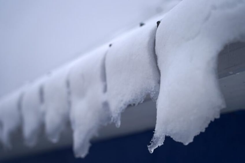 Snow melts on the roof of an ice fishing cabin in Sainte-Anne-de-la-Perade, Quebec, Canada