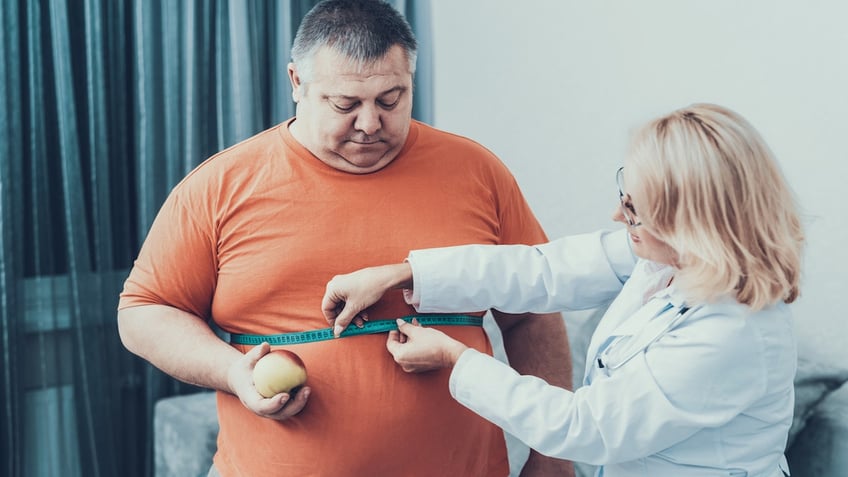 Obese man with doctor