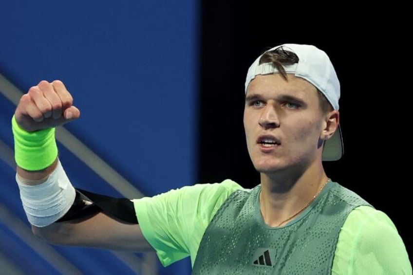 Teenage triumph: Jakub Mensik celebrates after defeating Gael Monfils