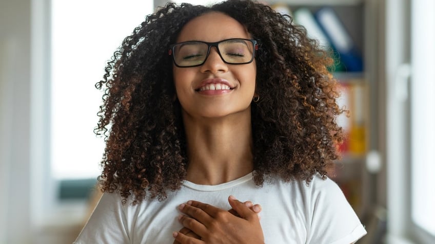 Woman holding heart