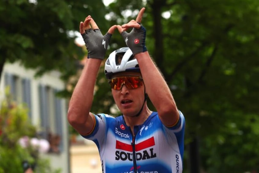 Tim Merlier celebrates his win at the third stage of the Giro d'Italia