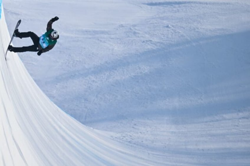 Afghanistan's Ahmad Habibzi competes in the men's snowboard halfpipe qualification during