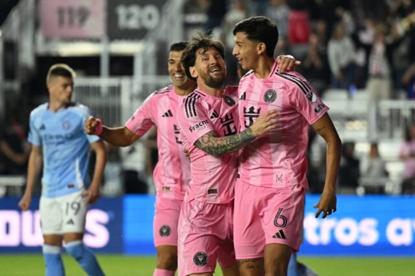 Lionel Messi celebrates with Inter Miami's Argentine defender Tomas Aviles who scored the