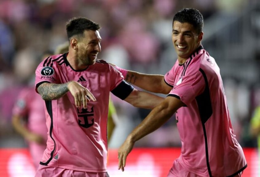 Lionel Messi celebrates with Luis Suarez after scoring in Inter Miami's 3-1 CONCACAF Champ