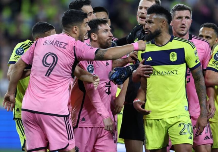 Luis Suarez and Lionel Messi of Inter Miami CF have words with Anibal Godoy of Nashville S