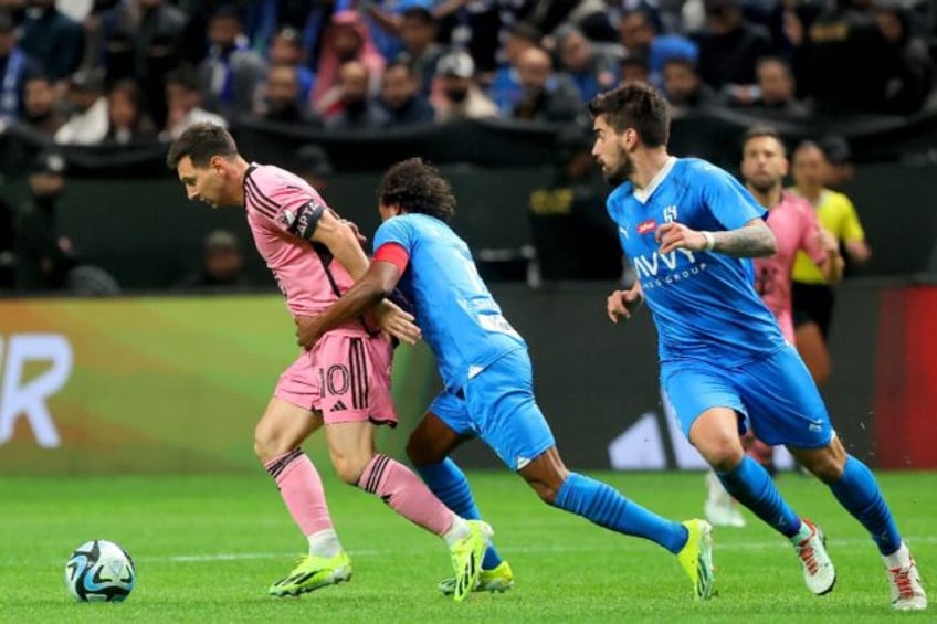 Inter Miami's Lionel Messi evades the Al Hilal defence in the MLS club's 4-3 friendly defeat on Monday