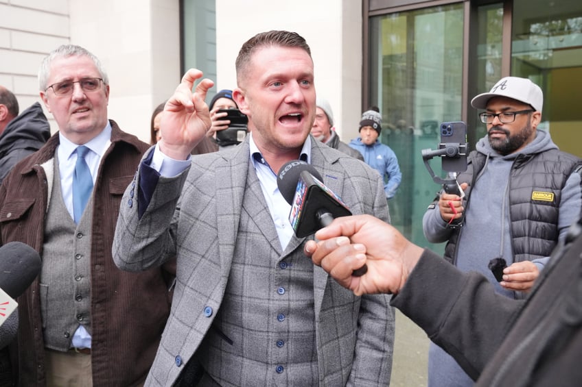 Tommy Robinson, real name Stephen Yaxley Lennon (centre) outside Westminster Magistrates' Court, central London, where he is accused of failing to comply with a direction to leave an antisemitism march in Westminster on November 26 of last year. Robinson was arrested near the Royal Courts of Justice in London, where the demonstration began, after organisers said he would not be welcome at the event. Picture date: Monday April 22, 2024. (Photo by Jonathan Brady/PA Images via Getty Images)