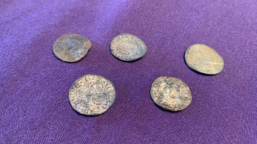 Five ancient coins spread out