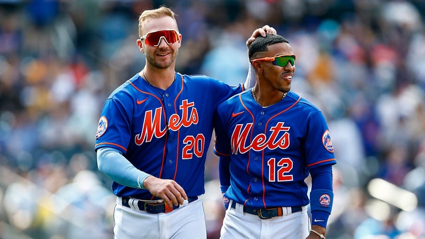 Pete Alonso and Francisco Lindor embrace