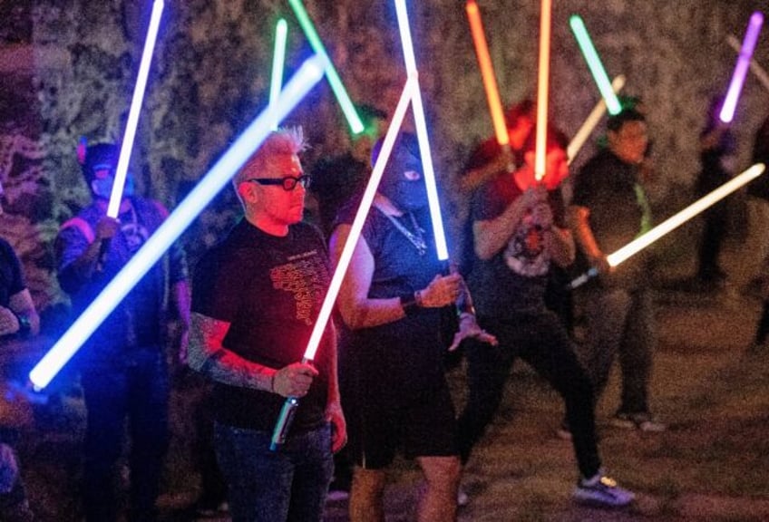 Members of the Jedi Knight Academy (JKAMX) train in a Mexican park