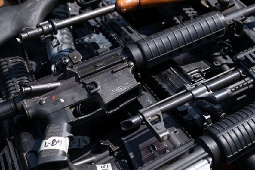 Guns seized by the Mexican security forces are seen in the border city of Tijuana