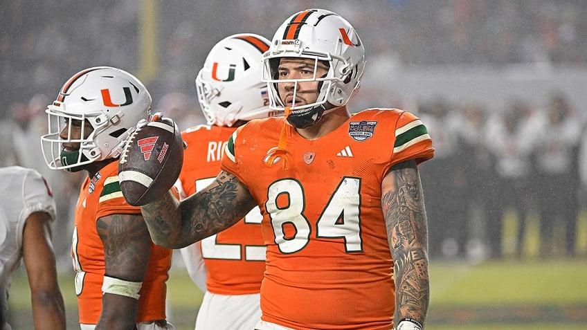 Cam McCormick holds ball