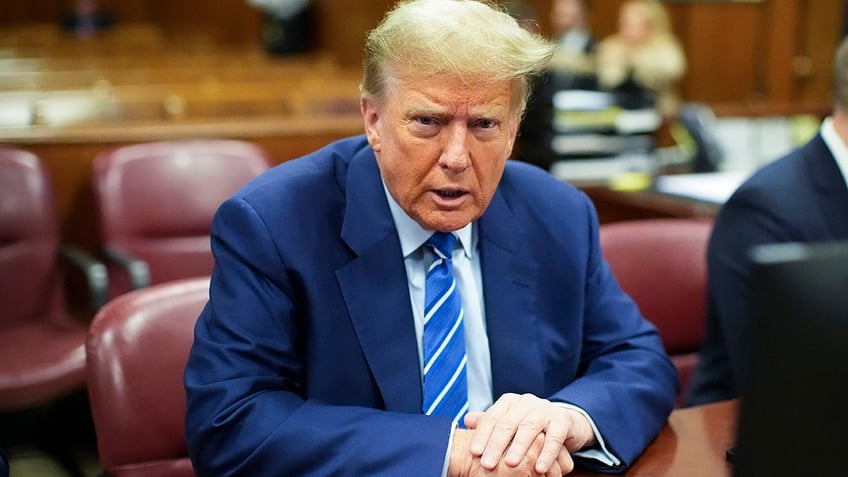 Former President Donald Trump awaits the start of proceedings on the second day of jury selection at Manhattan criminal court