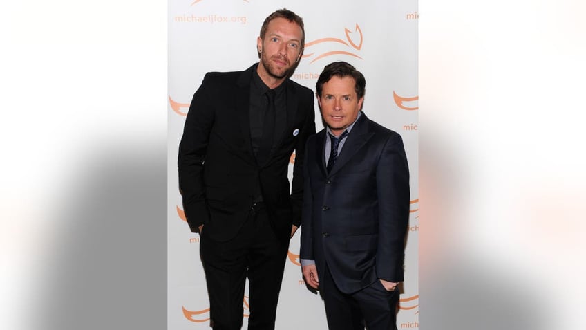 Chris Martin and Michael J. Fox posing together