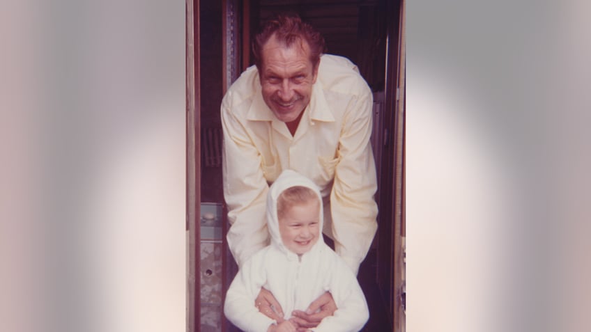 Vincent Price posing with his daughter