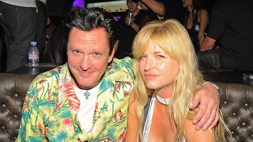 Michael Madsen wears colorful shirt next to wife DeAnna.