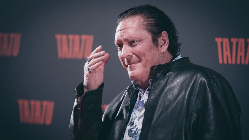 Actor Michael Madsen wears leather jacket at press preview