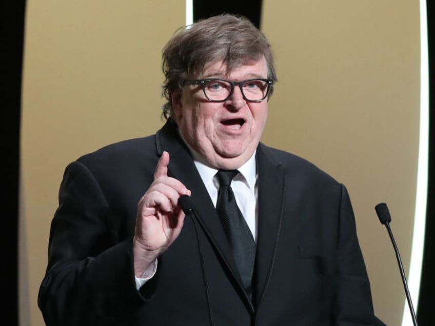 US Michael Moore delivers a speech on stage before awarding the Jury Prize on May 25, 2019