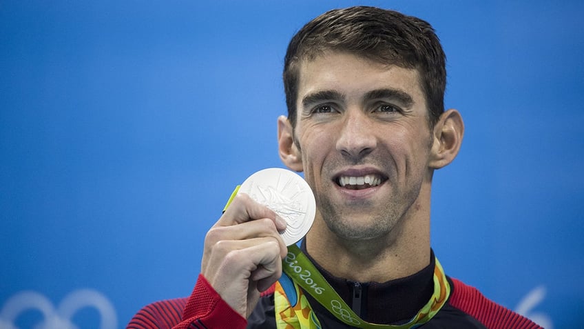 Michael Phelps with his medal