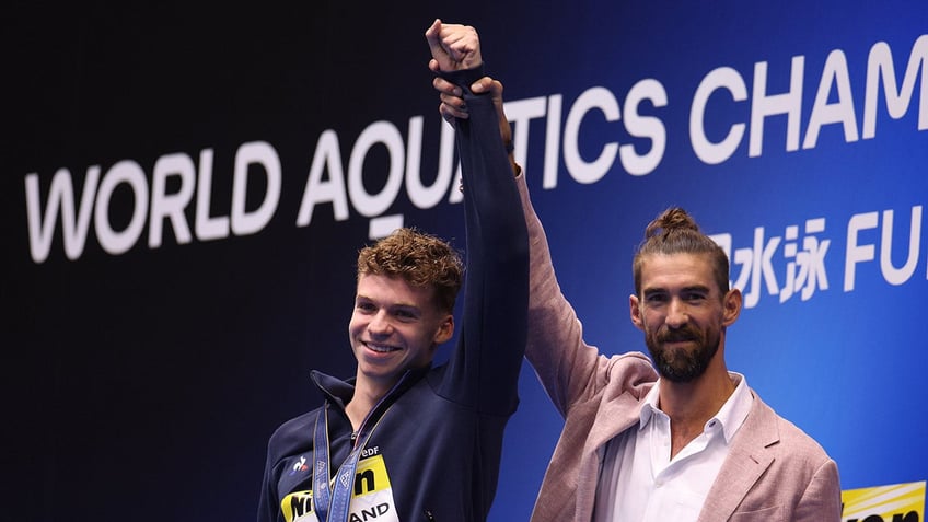 michael phelps watches final individual swimming record shattered by french phenom that was insane