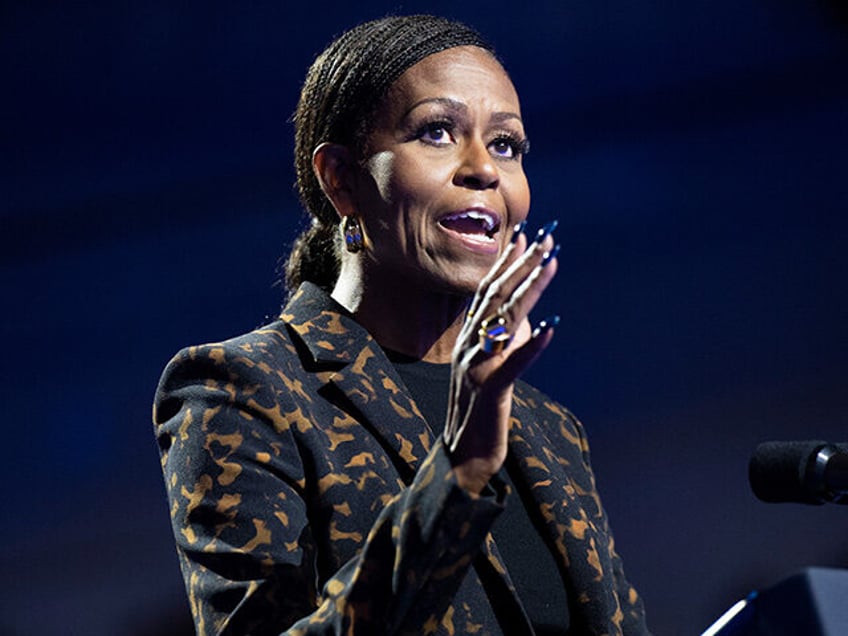 Former US First Lady Michelle Obama speaks during a campaign rally with US Vice President