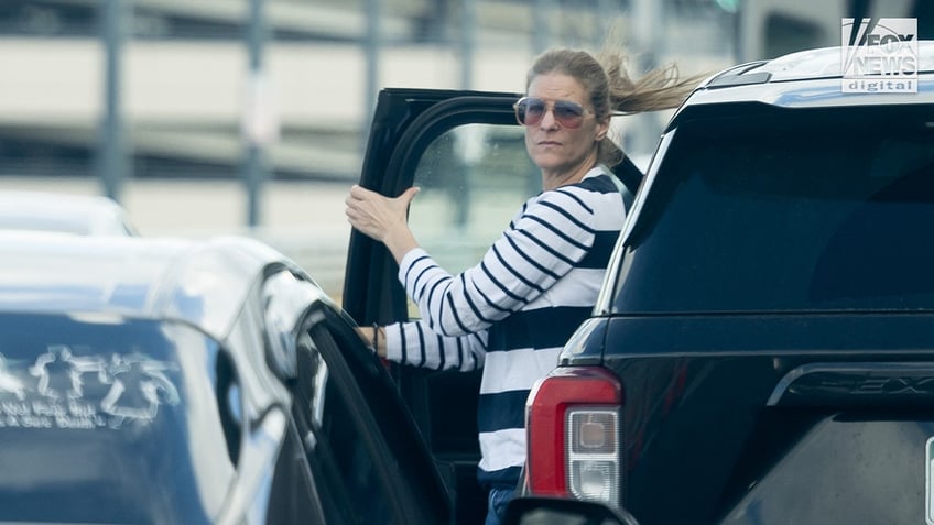 Michelle Troconis and her father unload bags while dropping off a family member at John F. Kennedy International Airport