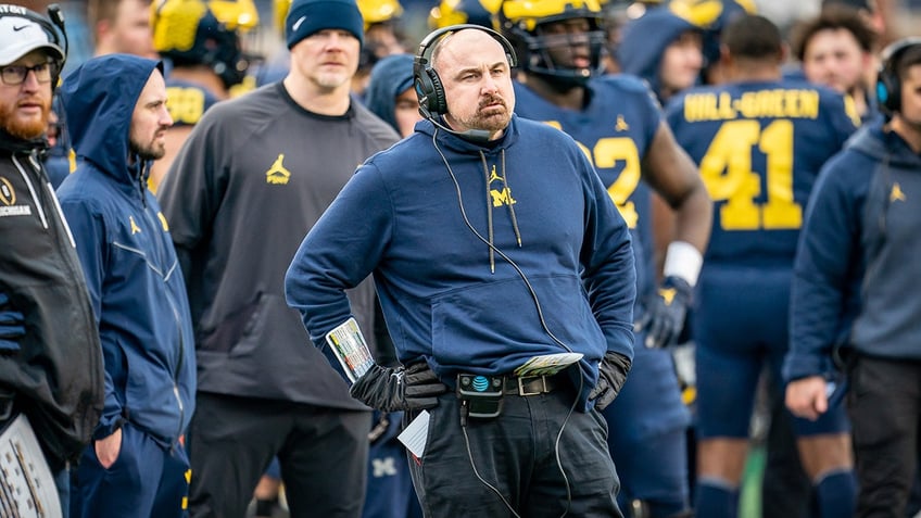 michigan assistant coach chris partridge dismissed just one day after jim harbaugh accepts three game ban